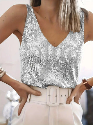 Manda | Glittertop met V-hals voor dames, versierd met pailletten en sprankelende details. Zilver